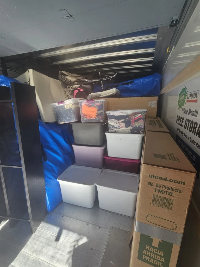 Efficient moving truck packed with boxes and furniture, showing professional and organized relocation services.