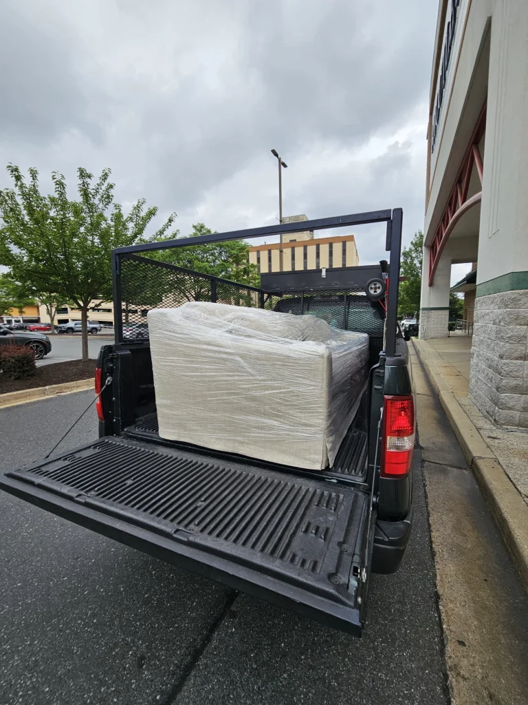 Pickup truck loaded with furniture, Sofa